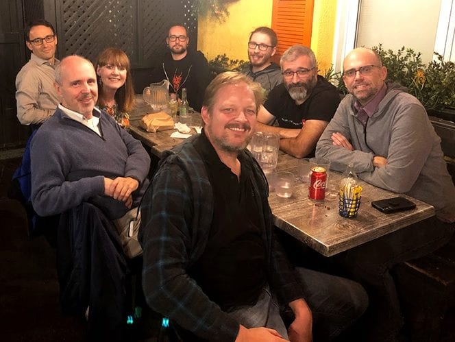 Enjoying some Montreal poutine at the end of a hard day brainstorming at our XLOC Summit in 2019. (Front, L-R) Roberto Lambiase, Jenny McKearney, Fabio Minazzi and Mason Deming. (Back, L-R) Sebastian Maeser, Arseniy Politov, Paolo Pirocchi and Carlos Garcia-Shelton